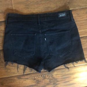 Black Levi's high rise shorts cut offs